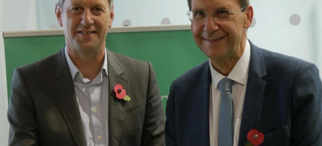 Professor Stephen Belcher, Chief Scientist at the Met Office and Professor Mark Goodwin, Deputy Vice-Chancellor at the University of Exeter, signing the agreement as COP26. Professor Stephen Belcher and Professor Mark Goodwin