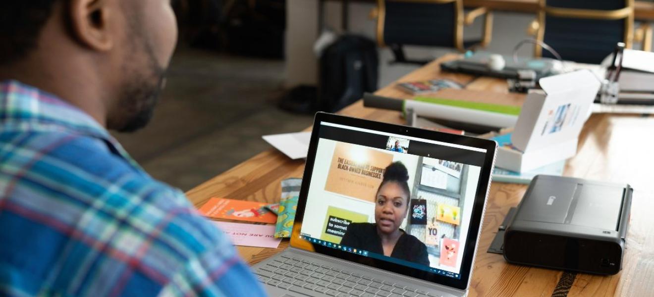 Virtual jobs fair Two people having a conversation via videocall