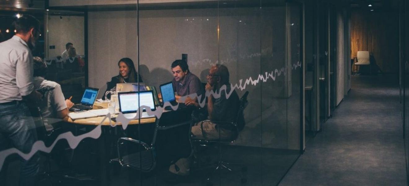 A group of young people in a shared office space