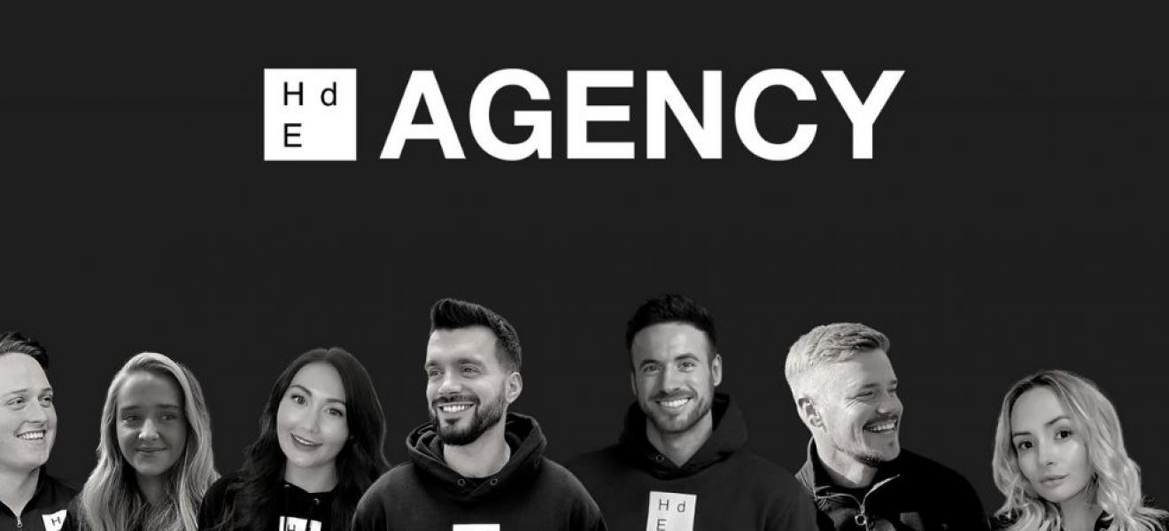 The HdE Agency staff with their logo above