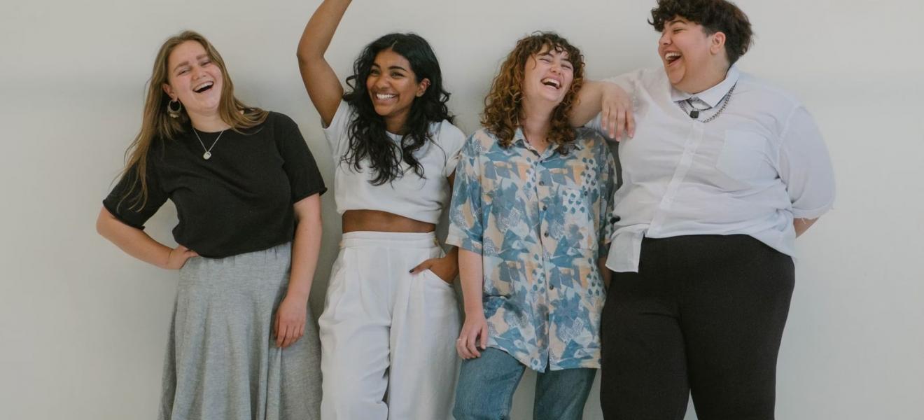 A diverse group of women laughing