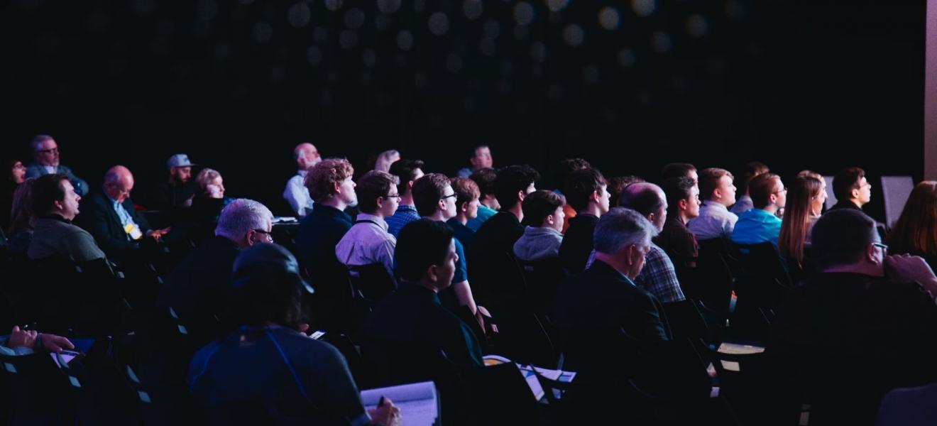 A crowd of people at a tech event