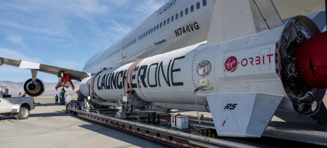 Launch technicians prepare LauncherOne for Above the Clouds mission.