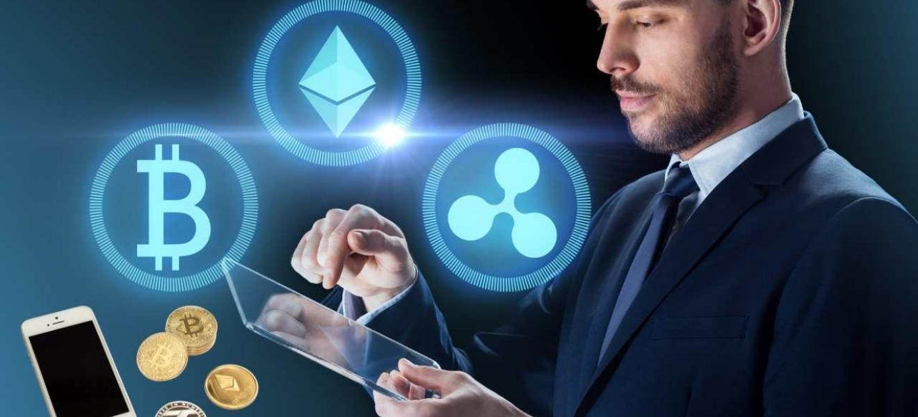 Cryptocurrency market hits £1.5 trillion A man with a tablet, from which cryptocurrency symbols are being emitted.