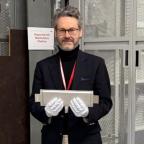 COO Christian Marston at UKBIC with one of the batteries