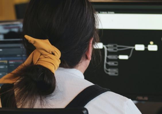 A person developing software at a computer A person developing software at a computer