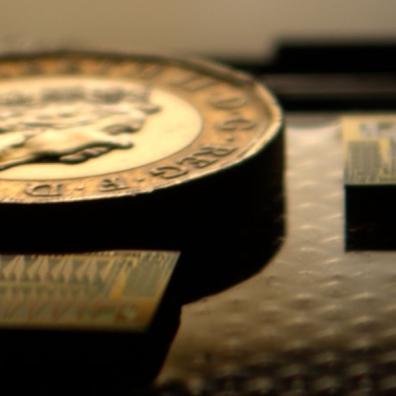 Siloton’s first-generation OCT chip (Akepa), with a British £1 coin for scale.