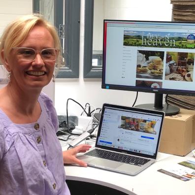 Caroline using a laptop at a desk