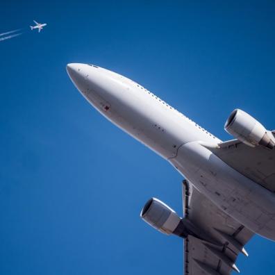 Two aircraft in flight, seen from below