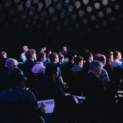 A crowd of people at a tech event