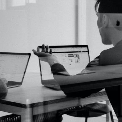 A software developer working at a laptop