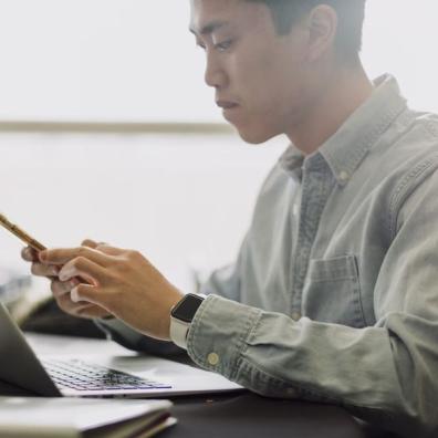 A tech worker using a laptop